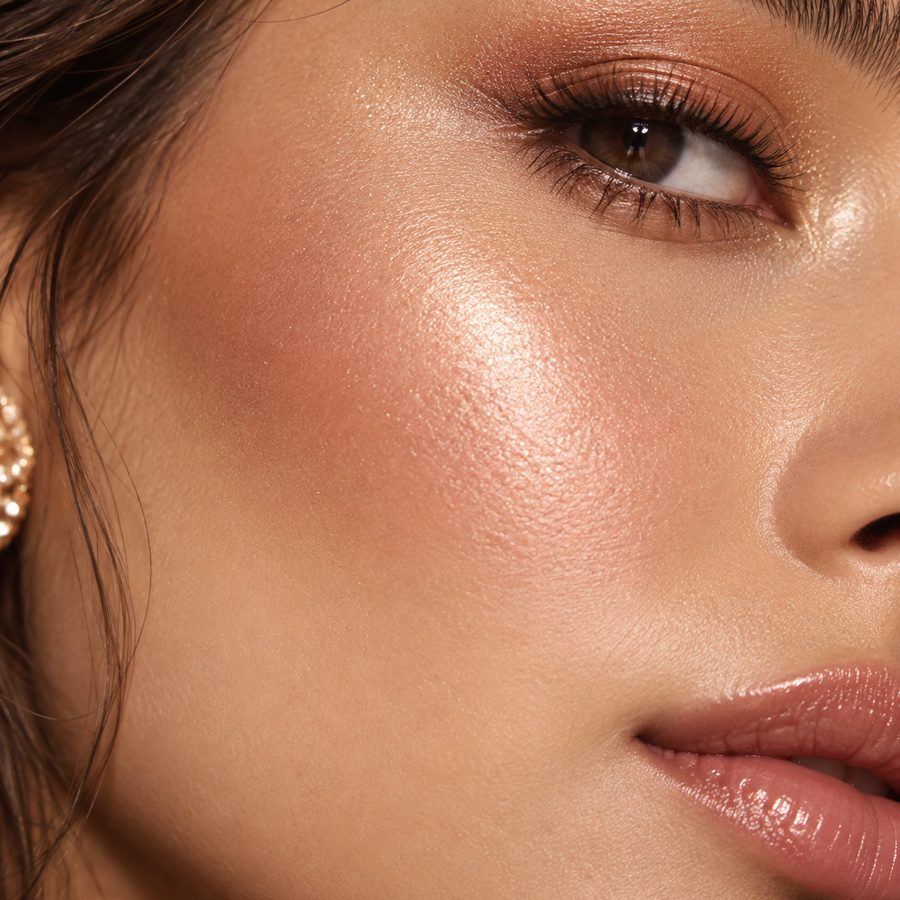 Macro close-up of blush, contour and highlight on the cheek